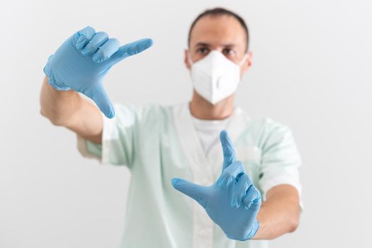 Man doctor medic in a protective respirator and face mask.