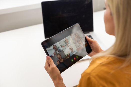 Woman In Video Conferencing Call On Tablet. Webinar Conference