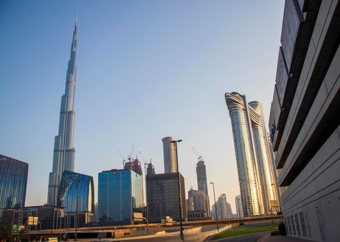 Dubai Financial Center road. Address Sky view hotel and Burj Khalifa tallest building in the world can be seen on the scene. Outdoors
