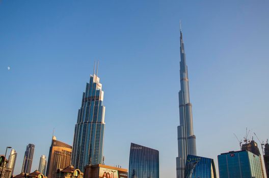 Dubai Financial Center road. Burj Khalifa tallest building in the world can be seen on the scene. Outdoors
