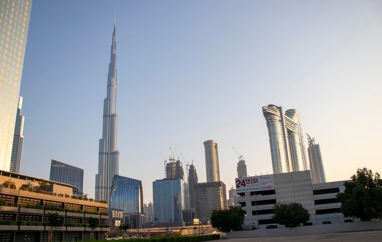 Dubai Financial Center road. Address Sky view hotel and Burj Khalifa tallest building in the world can be seen on the scene. Outdoors