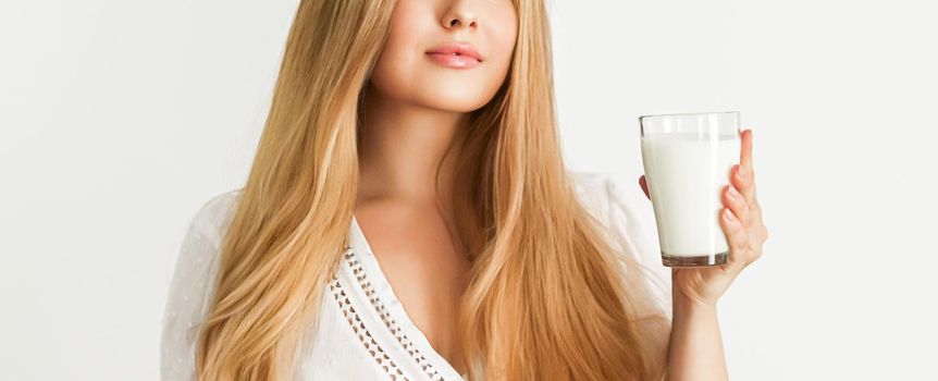 Diet, health and wellness concept, woman holding glass of milk or protein shake cocktail