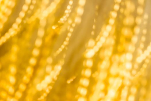 Golden Christmas lights, New Years Eve fireworks and abstract texture concept - Glamorous gold shiny glow and glitter, luxury holiday background