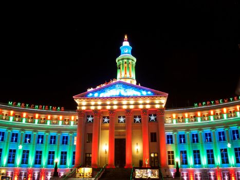 Downtown Denver at Christmas. Denver's City and County building decorated with holiday lights.