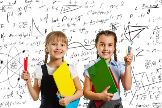 children on the background of formulas, isolated on wall chalk board background. Childhood children kids education lifestyle concept.