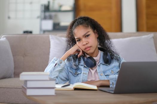 Work from home, Young asian woman struggle with laptop computer, Frustrated asia girl looking at laptop while studying online class, online business, e learning, People struggle with technology.