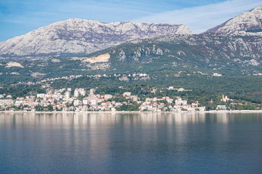 View of Bay of Kotor from the sea surrounded by mountains in Montenegro, one of the most beautiful bay in the world.