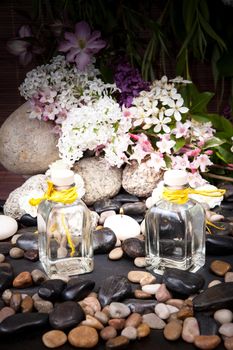 Aromatherapy, spa, beauty treatment and wellness background with massage stone, flowers, burning candles... spa concept