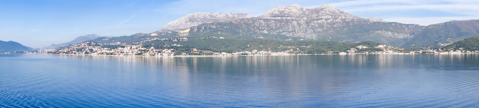 Panoramic view of Bay of Kotor from the sea surrounded by mountains in Montenegro, one of the most beautiful bay in the world.
