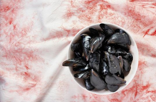 Heap of mussels in white plate , preparing healthy eating food