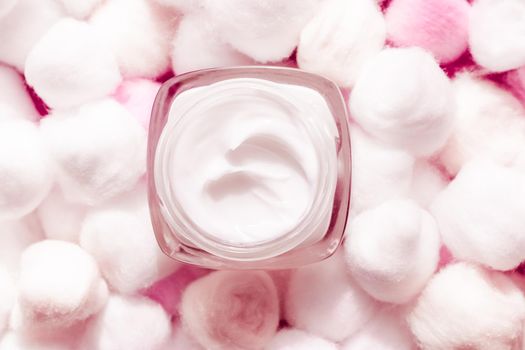 Cosmetic branding, moisturizing emulsion and facial care concept - Luxury face cream for sensitive skin and pink cotton balls on background, spa cosmetics and natural skincare beauty brand product
