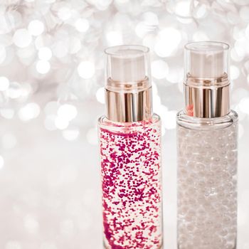 Cosmetic branding, blank label and glamour present concept - Holiday make-up base gel, serum emulsion, lotion bottle and silver glitter, luxury skin and body care cosmetics for beauty brand ads