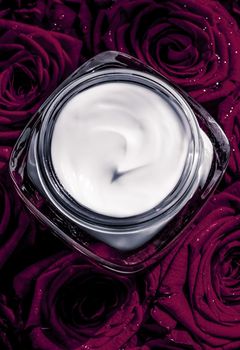 Luxe cosmetics, branding and anti-age concept - Face cream skin moisturizer and dark purple roses, luxury skincare cosmetic product on floral background as beauty brand holiday flatlay design