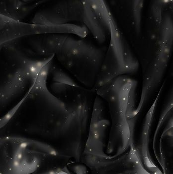 Winter fashion, shiny fabric and night party style concept - Magic holiday black silk flatlay background texture with golden shine, luxury glamour abstract backdrop