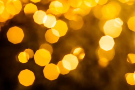 Golden Christmas lights, New Years Eve fireworks and abstract texture concept - Glamorous gold shiny glow and glitter, luxury holiday background