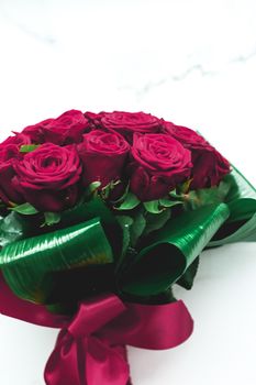 Gift for her, romantic relationship and floral design concept - Luxury bouquet of burgundy roses on marble background, beautiful flowers as holiday love present on Valentines Day