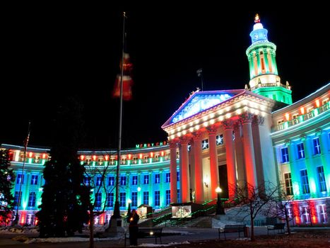 Downtown Denver at Christmas. Denver's City and County building decorated with holiday lights.