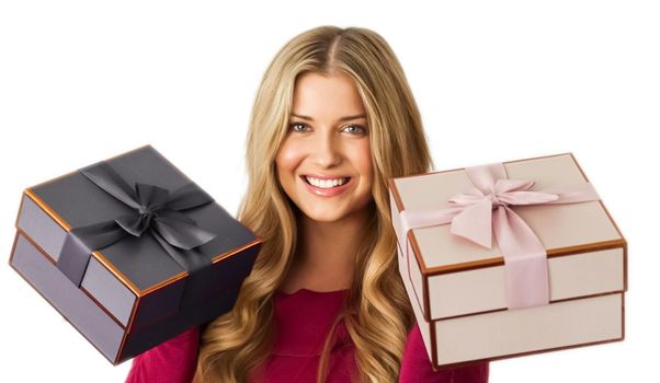 Birthday, Christmas gifts or holiday present, happy woman holding gift boxes isolated on white background, portrait