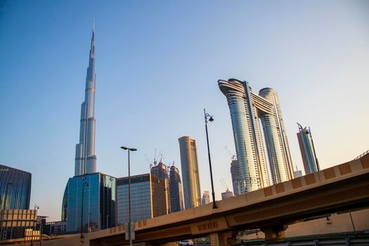 Dubai Financial Center road. Address Sky view hotel and Burj Khalifa tallest building in the world can be seen on the scene. Outdoors