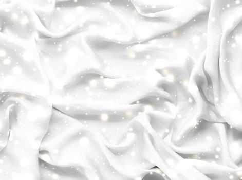 Winter fashion, shiny fabric and glamour style concept - Magic holiday white soft silk flatlay background texture with glowing snow, luxury beauty abstract backdrop