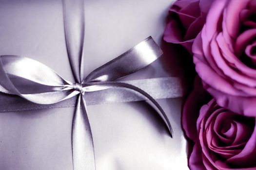 Luxurious design, shop sale promotion and happy surprise concept - Luxury holiday silver gift box and pink roses as Christmas, Valentines Day or birthday present