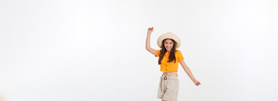 Cool hipster portrait of young stylish teen girl showing her hands up, positive mood and emotions,travel alone. Isolated over grey background.