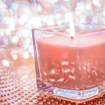 Festive decoration, branding and aromatherapy spa concept - Coral aromatic candle on Christmas and New Years glitter background, Valentines Day luxury home decor and holiday season brand design