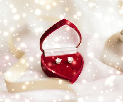 Timeless luxury, romantic proposal and happy celebration concept - Diamond earrings in a heart shaped jewellery gift box, love present for Christmas, New Years Eve, Valentines Day and winter holidays