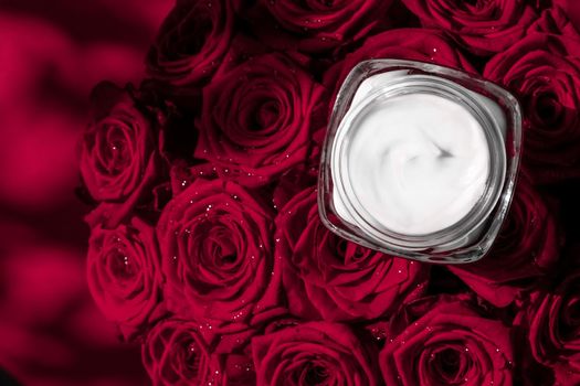 Luxe cosmetics, branding and anti-age concept - Face cream skin moisturizer and red roses flowers, luxury skincare cosmetic product on floral background as beauty brand holiday flatlay design