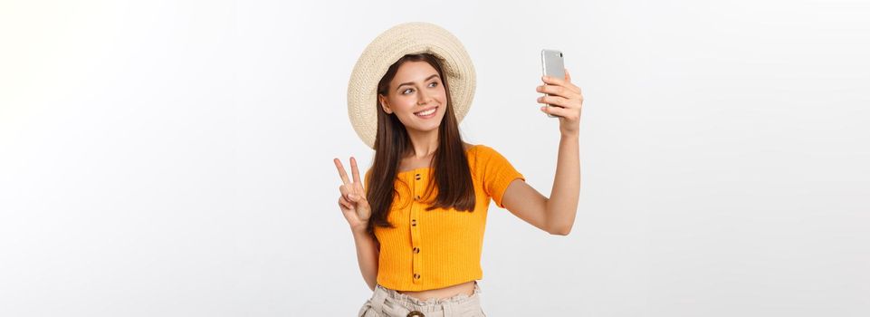 Young Caucasian woman enjoying the selfie with herself isolated on white background summer travel concept