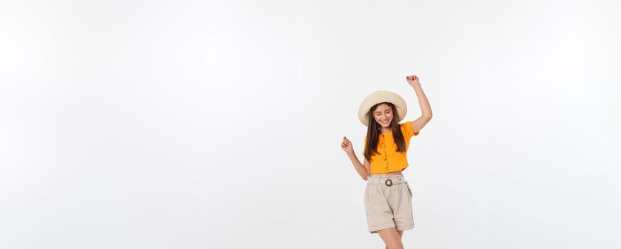 Cool hipster portrait of young stylish teen girl showing her hands up, positive mood and emotions,travel alone. Isolated over grey background.