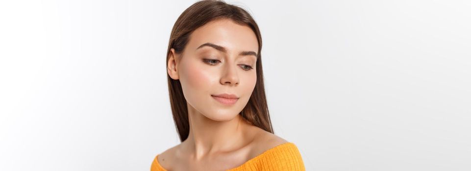 friendly smiling young woman with beatiful face portrait studio shot.