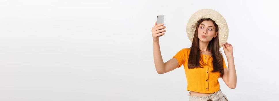 Young Caucasian woman enjoying the selfie with herself isolated on white background summer travel concept