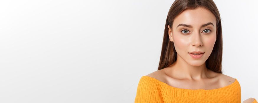 friendly smiling young woman with beatiful face portrait studio shot.