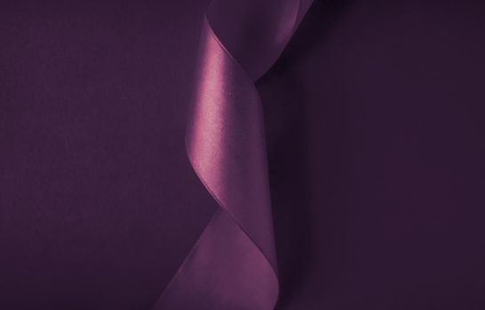 Branding, holidays and luxe brands concept - Abstract curly silk ribbon on purple background, exclusive luxury brand design for holiday sale product promotion and glamour art invitation card backdrop