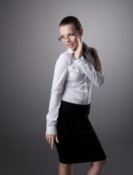 Sexy young business woman in glasses look at light