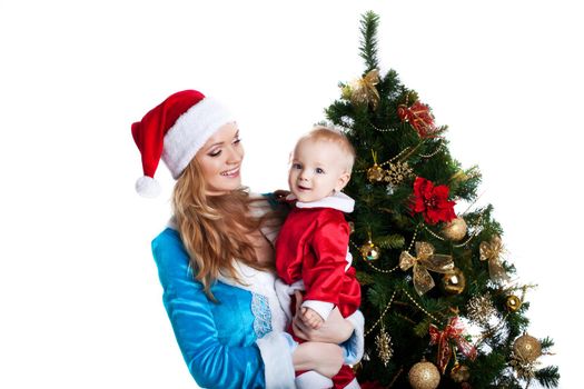 Beauty christmas girl in blue cloth play with baby santa claus in red near fir tree