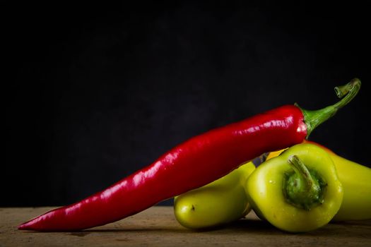 Hot jalapeno peppers. Mexican food. Red and green pepper close-up. Burning food. Pepper pods.