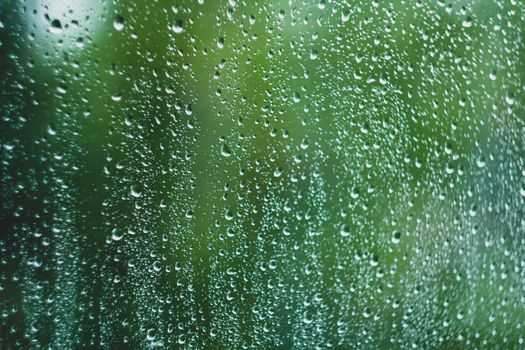 Sun after rain. Drops on glass. It's been raining. Texture on glass. Autumn mood.