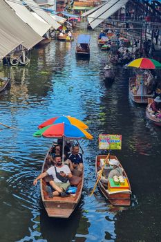 People at Damnoen saduak floating market, Bangkok Thailand. colorful floating market in Thailand