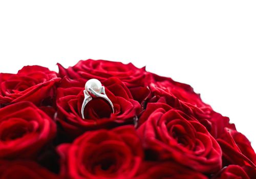 Gemstone jewellery, wedding present and engagement proposal concept - Beautiful white gold pearl ring and bouquet of red roses, luxury jewelry love gift on Valentines Day and romantic holidays