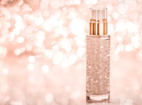 Cosmetic branding, blank label and glamour present concept - Holiday make-up base gel, serum emulsion, lotion bottle and rose gold glitter, luxury skin and body care cosmetics for beauty brand ads