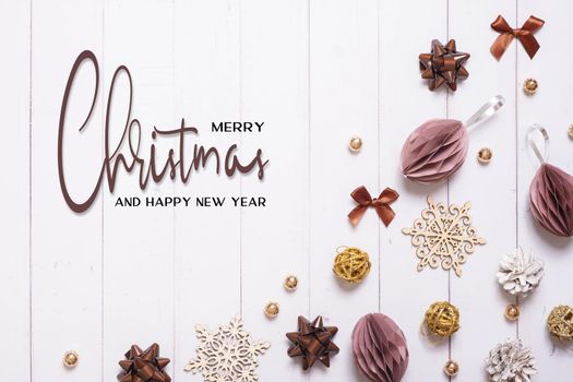 Merrry Christmas and Happy new year greeting card with composition flat lay on wooden background.