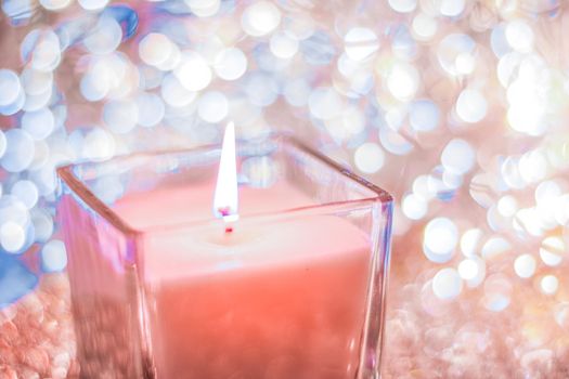 Festive decoration, branding and aromatherapy spa concept - Coral aromatic candle on Christmas and New Years glitter background, Valentines Day luxury home decor and holiday season brand design