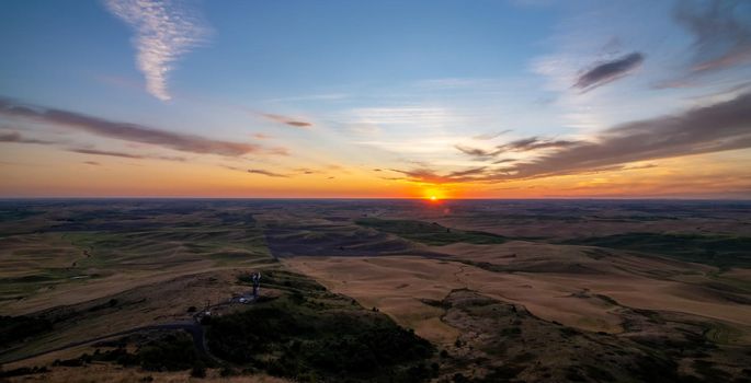 Sun setting below the horizon in a loose region of eastern Washington