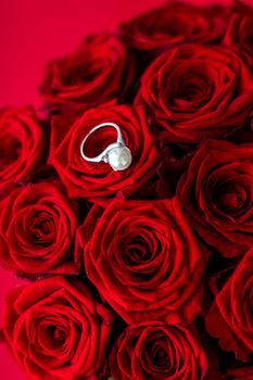 Gemstone jewellery, wedding present and engagement proposal concept - Beautiful white gold pearl ring and bouquet of red roses, luxury jewelry love gift on Valentines Day and romantic holidays