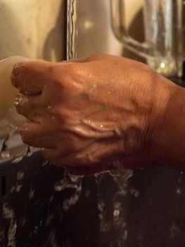 cleaning a raw adriatic cuttlefish at home in Numana, Marche, Italy