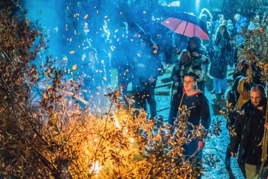 Montenegro, Budva 7.01. 2021: Christian Christmas in Montenegro, the feast of the oak branch. People burn an oak branch in honor of Christmas.