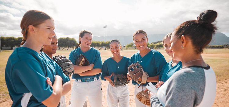 Baseball, team and women with coach talking, conversation or speaking about game strategy. Motivation, teamwork and collaboration with leader coaching girls in softball sports training exercise