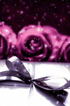 Luxurious design, shop sale promotion and happy surprise concept - Luxury holiday silver gift box and pink roses as Christmas, Valentines Day or birthday present